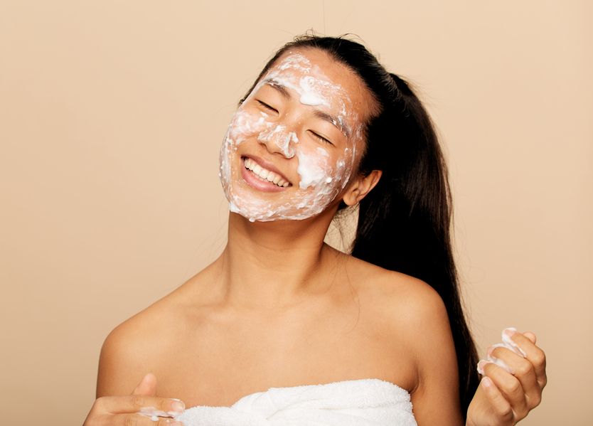Woman with face mask smiling