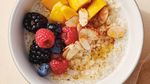 Quinoa oatmeal with berries, mango and almond slivers; from "Eat Better, Feel Better" by Giada DeLaurentiis