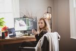 Kate McLeod sitting at her desk
