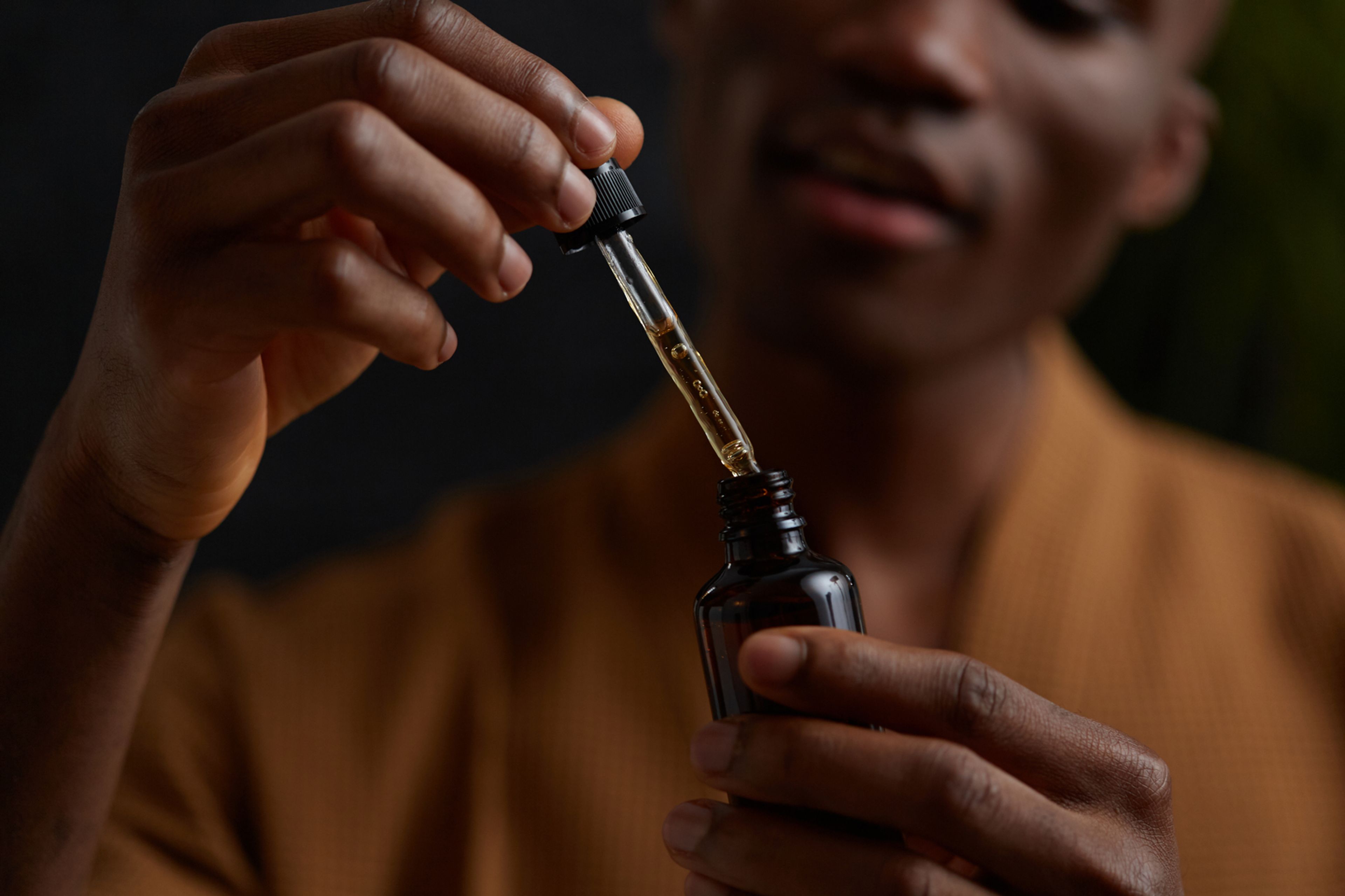 A man playing with oil
