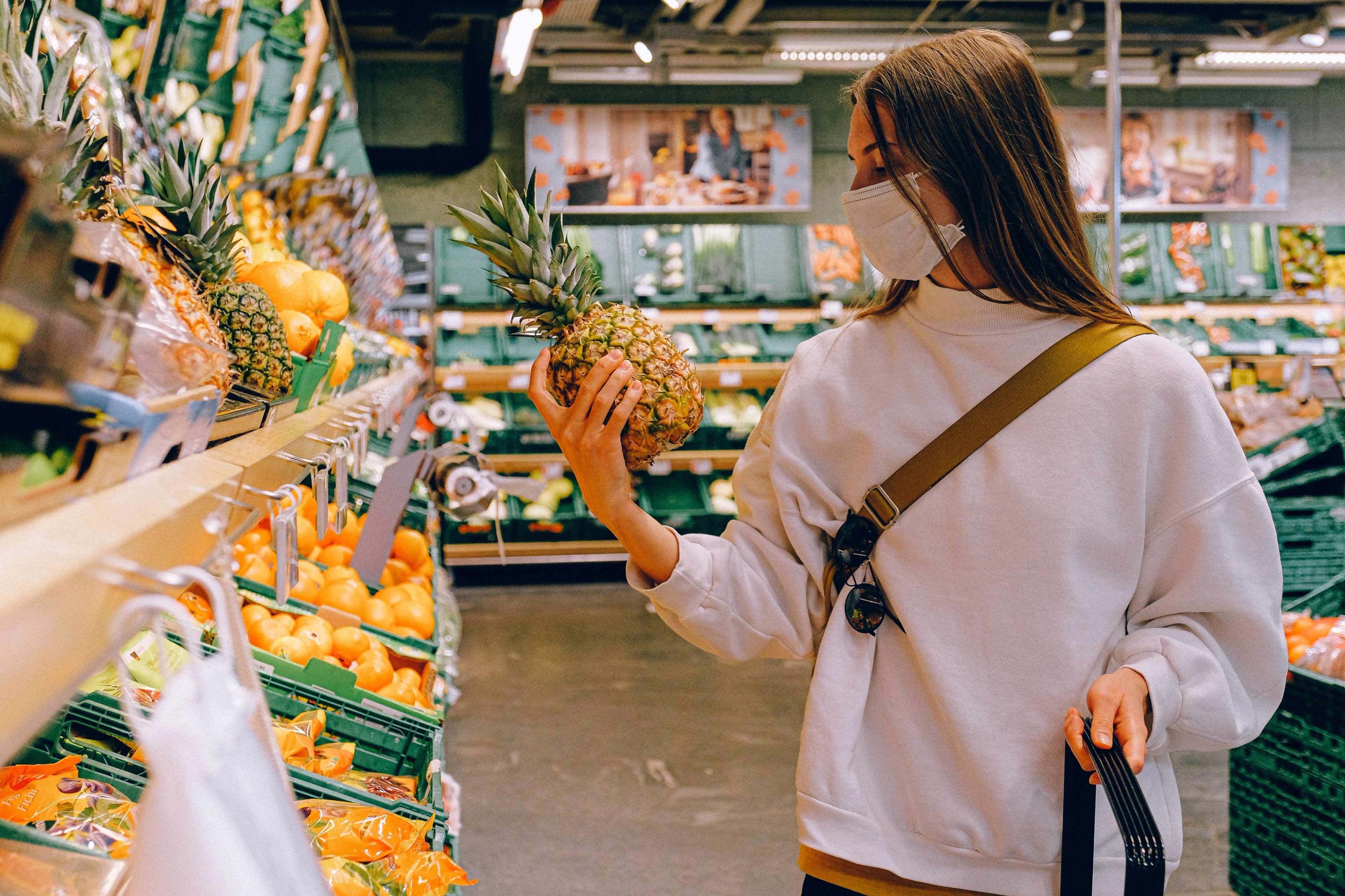 Woman Wearing Mask at Supermarket. Photo by Anna Shvets from Pexels.