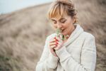 Woman smelling flowers