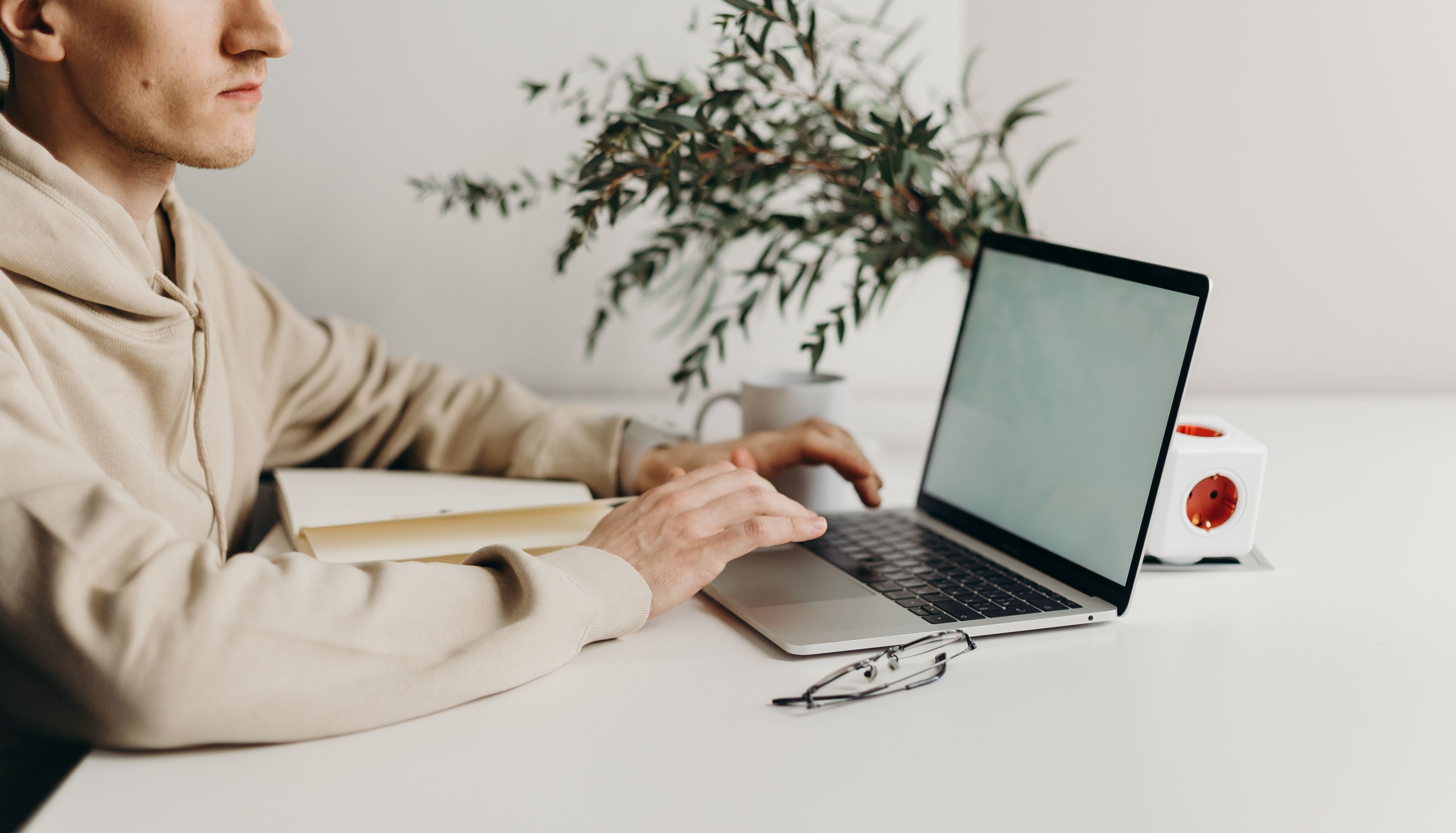 A man sits at desk with computer