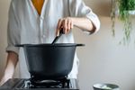 woman making soup