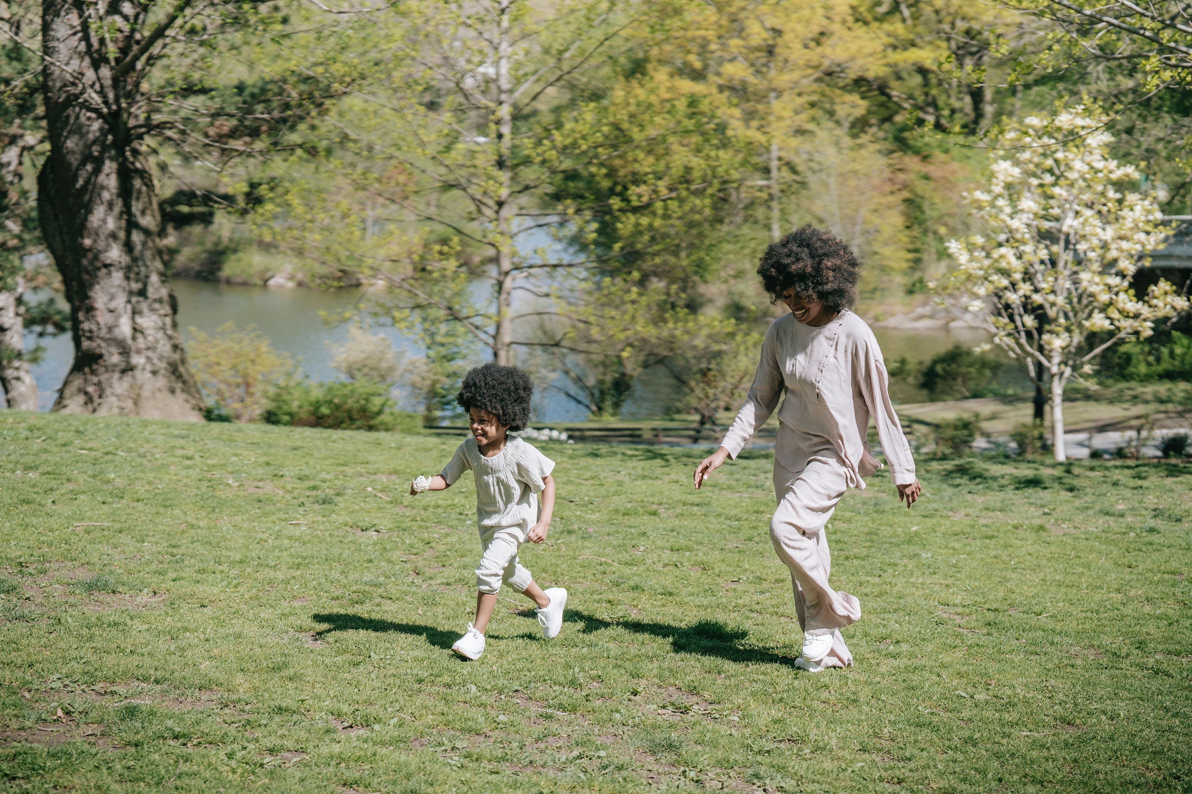 Woman walking with her daughter in the park