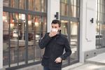 man in mask on city street