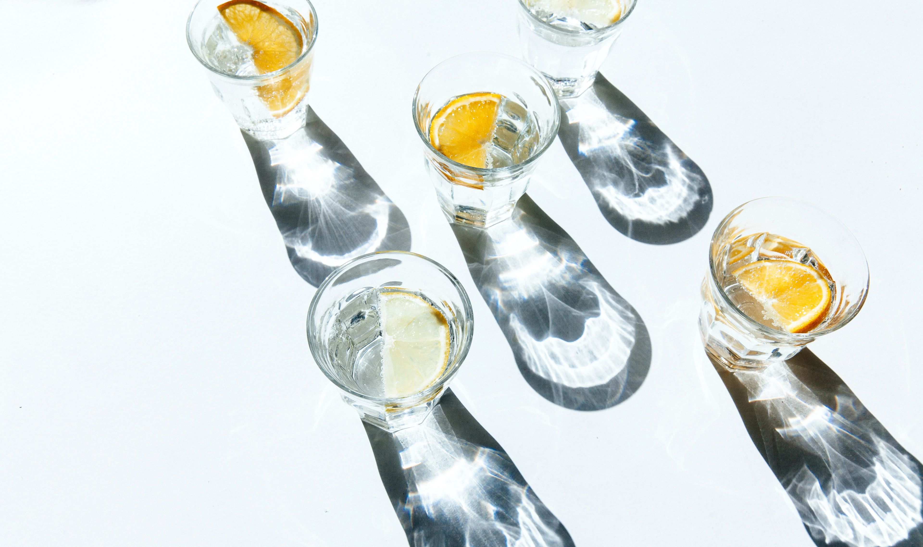 Glasses of water with citrus