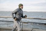 Older man running by water