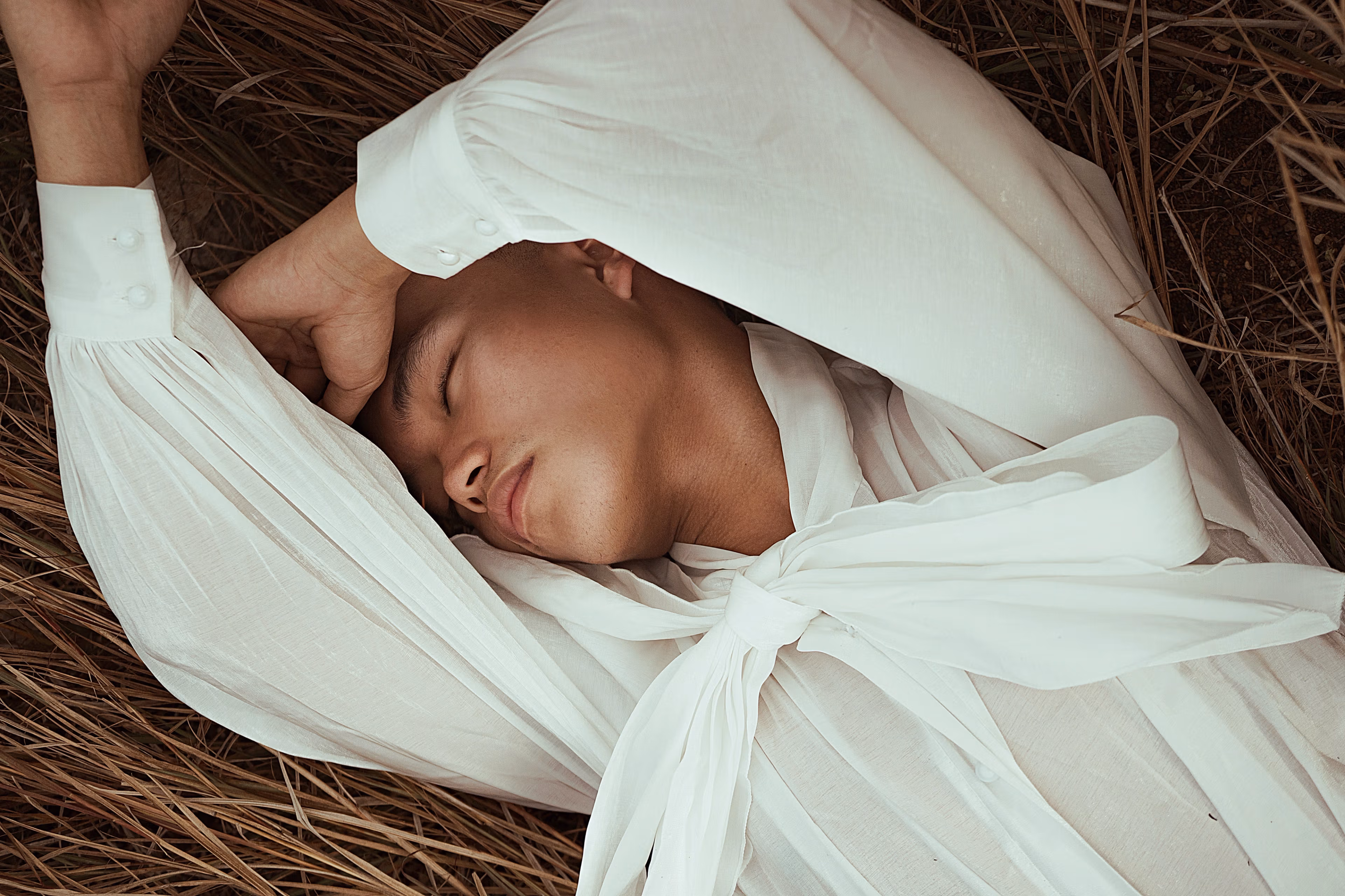Person laying in a field