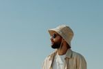 man wearing bucket hat and sunglasses