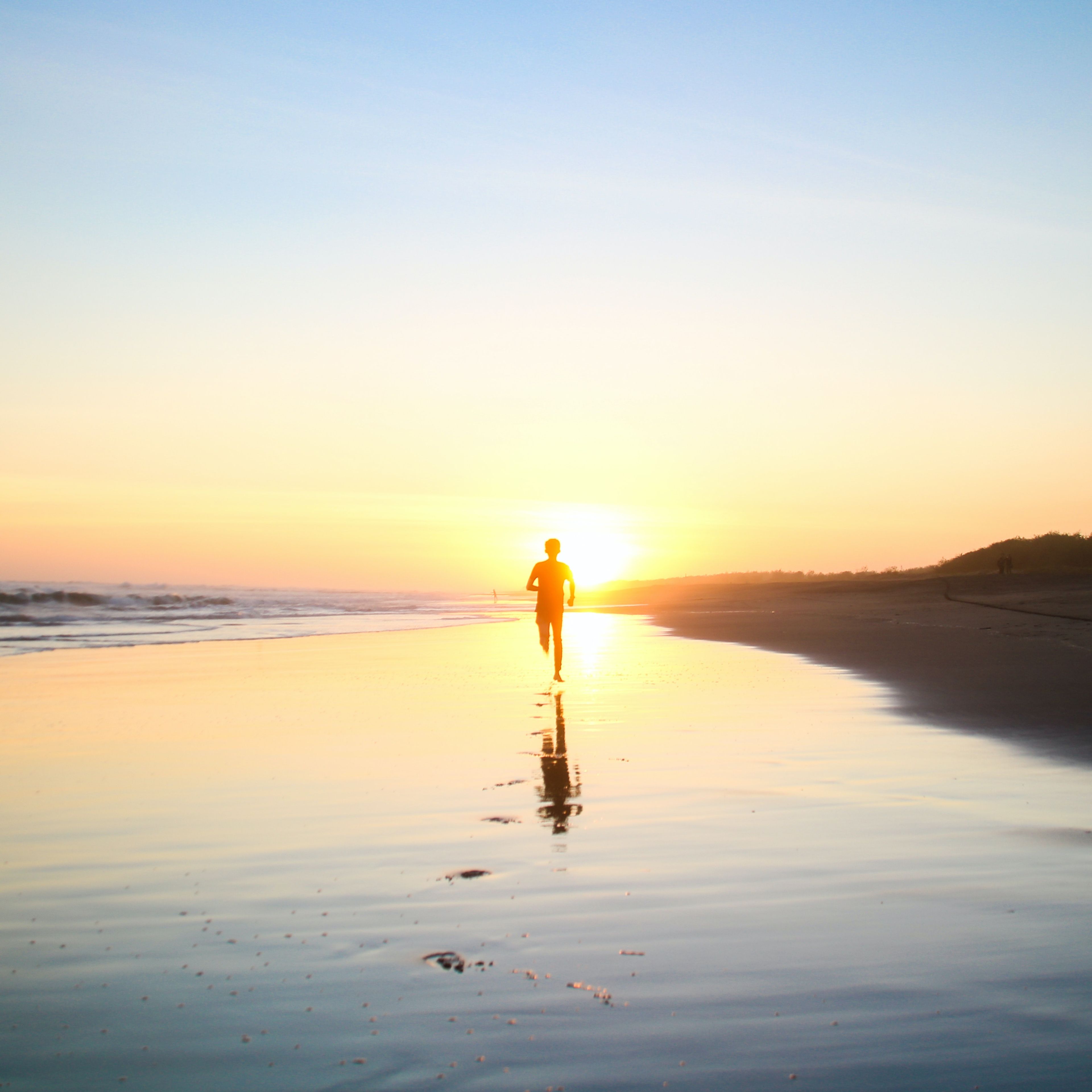 man running on beach