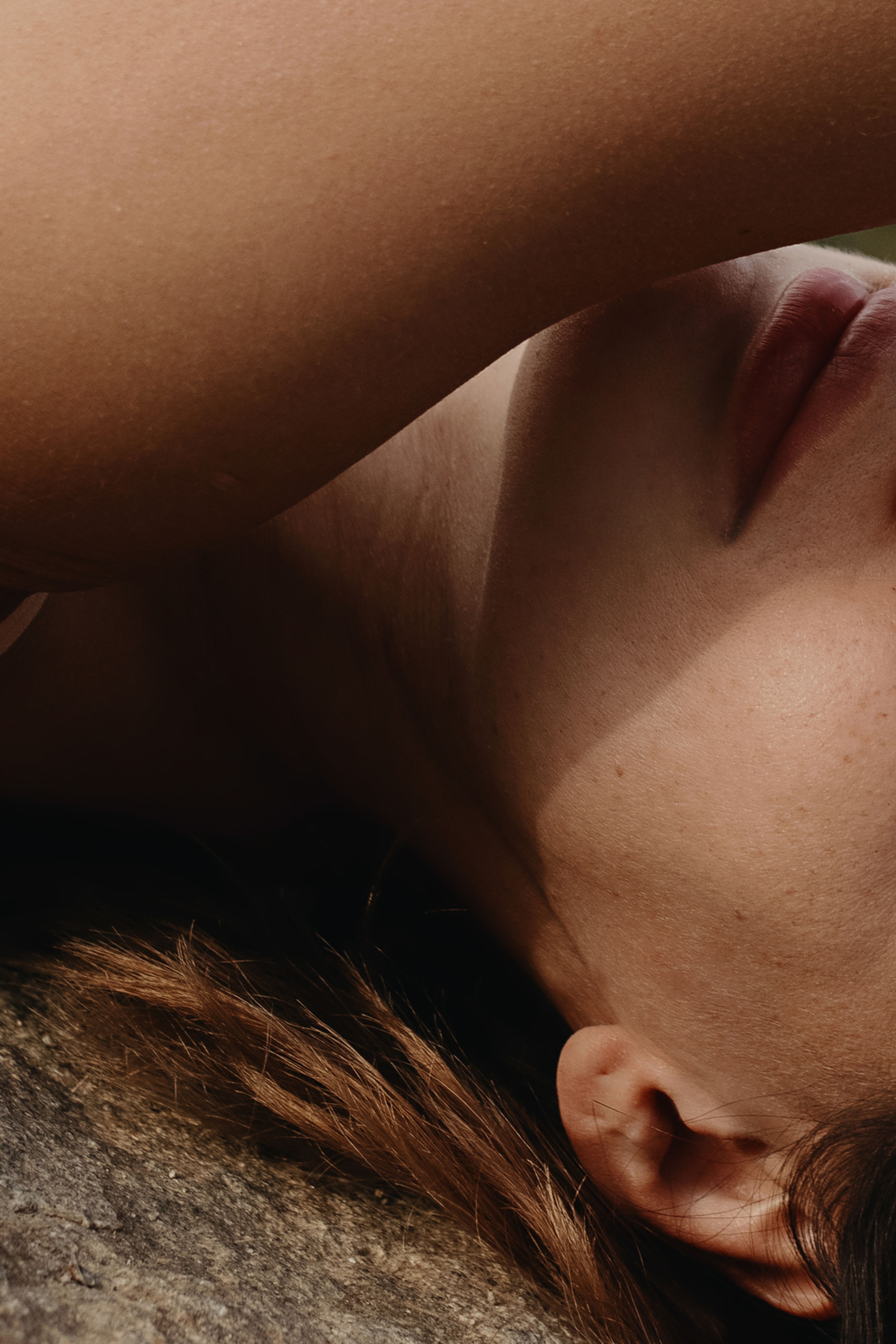 Close shot of woman's face and arm