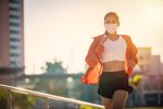 Woman running outside with mask on