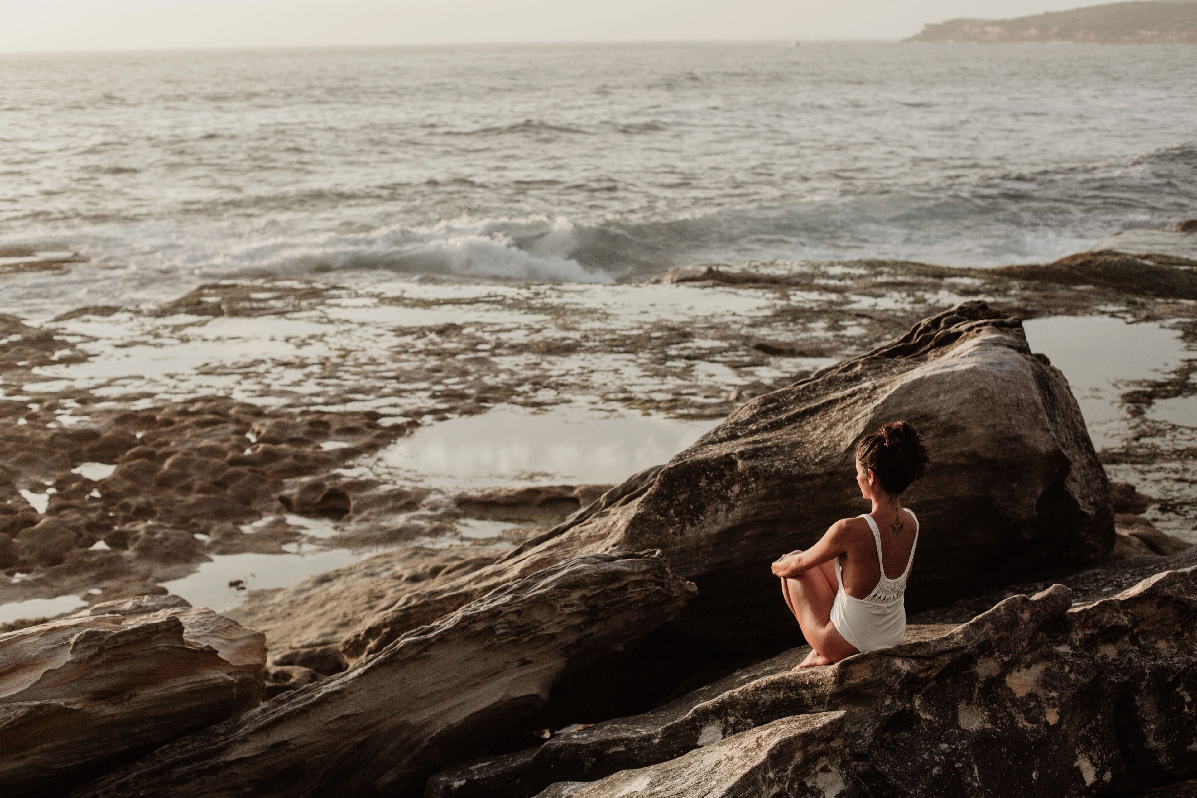Woman on the beach thinking about life